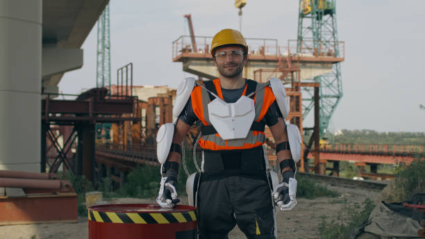 istock Male contractor in exoskeleton standing near barrel 1336631795
