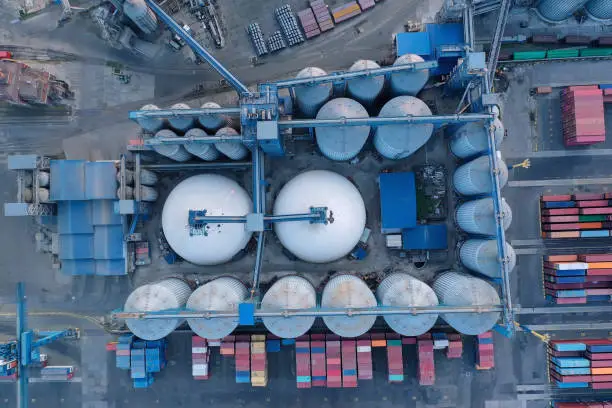 Photo of Aerial view oil terminal is industrial facility for storage of oil and petrochemical products ready for transport to further storage facilities.