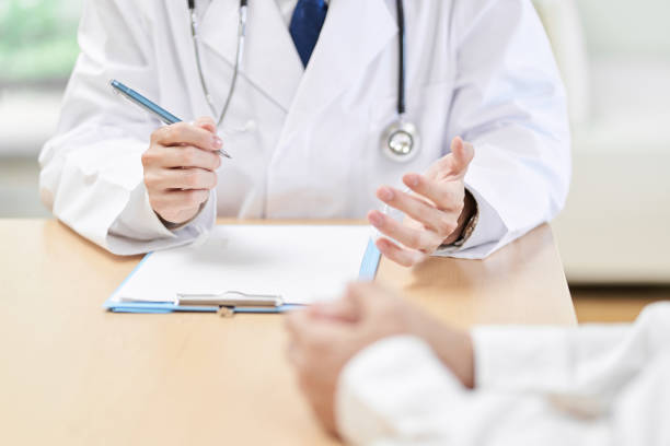 Hands of a male doctor explaining symptoms to the patient Hands of a male doctor explaining symptoms to the patient obscured face stock pictures, royalty-free photos & images