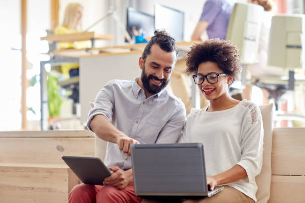 istock creative team with laptop and tablet pc in office 1336634597