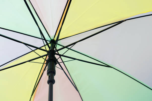 istock pastel color umbrella in under 1336638023