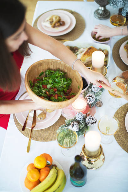istock Friends celebrating Christmas at home 1336638057
