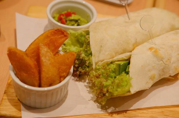 istock Mexico chicken roll Burrito taco with potato chip 1336638394