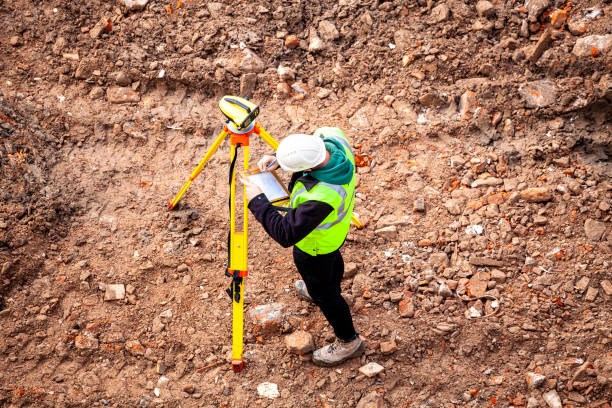 istock A surveyor on a construction site uses an optical level 1336639542
