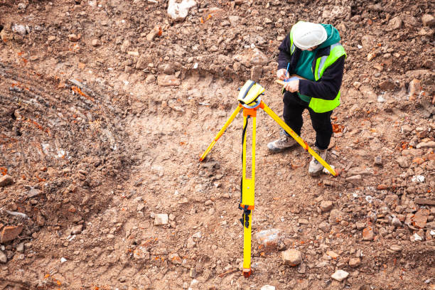 istock A surveyor on a construction site uses an optical level 1336639543