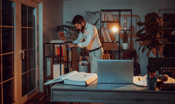 istock Male writer working at night 1336639806