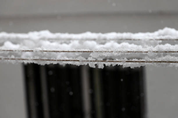 istock snowflakes deposited on the clothesline 1336640257