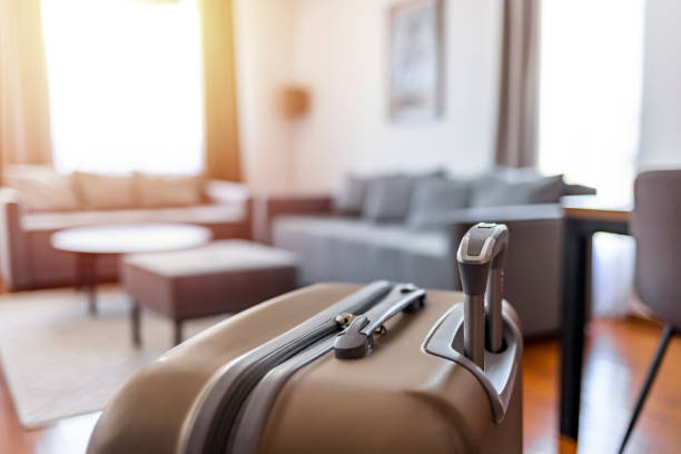 istock Beautiful modern hotel room and suitcase 1336640851