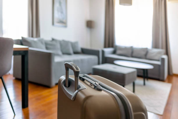suitcases packed for travel on  living room floor