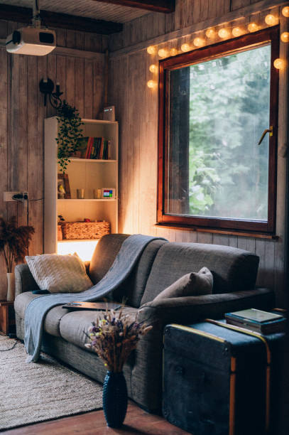 istock Cozy home interior background with video projector 1336640910