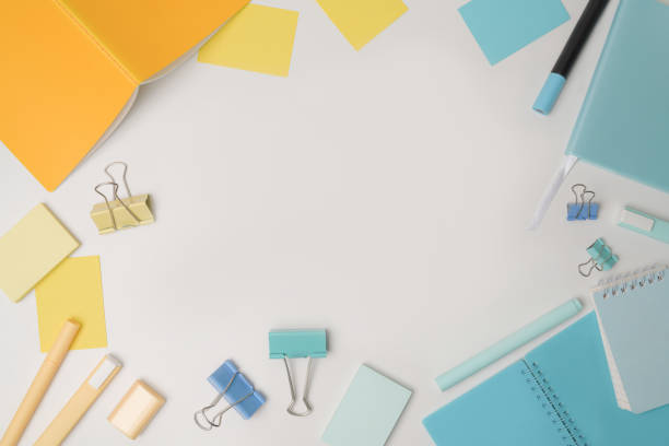 istock Top view colorful notebooks and stationery on white background. 1336641955