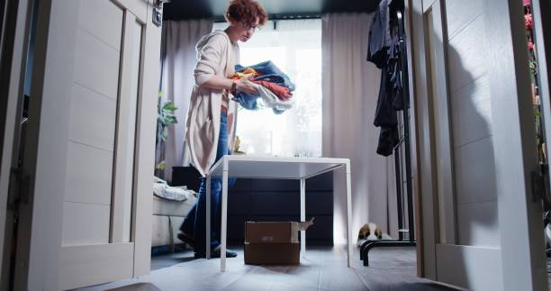 istock Mature woman is prepping donations at home 1336643331