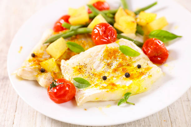 fish fillet with vegetables on plate