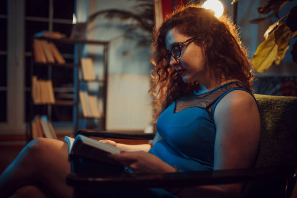 istock Woman reading a book 1336645950