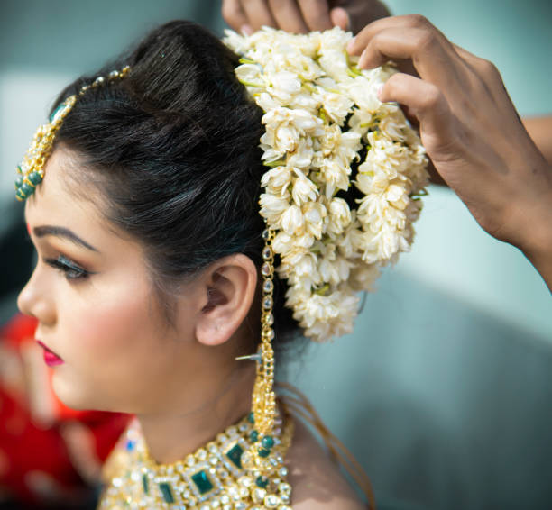 Beautiful Traditional Indian Bride Getting Ready For Her Wedding Day By A  Beautician Stock Photo - Download Image Now - iStock