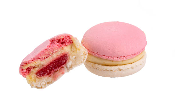 istock Exclusive pink macaroons eaten isolated on the white 1336651474