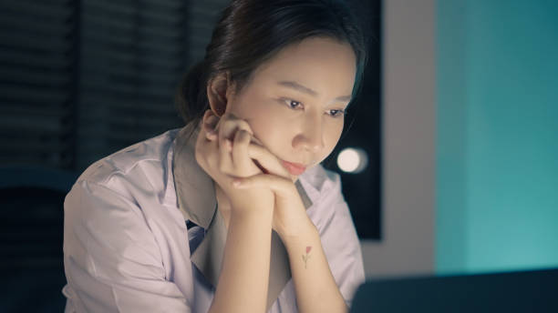 istock Doctor busy working on laptop late at night 1336652570