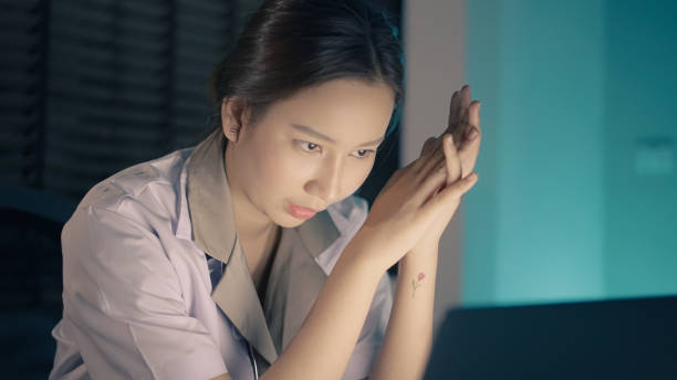 istock Woman feeling stress while working late at night 1336652592