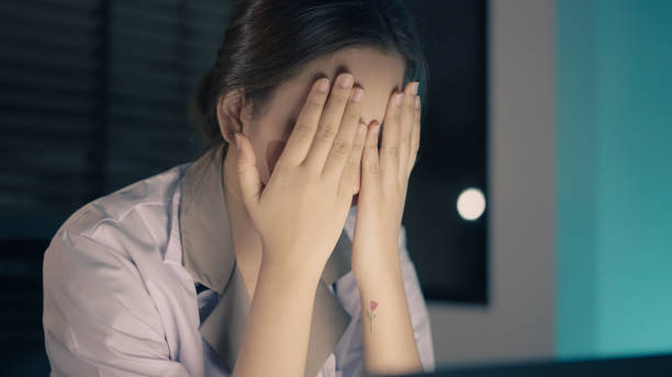 istock Doctor busy working on laptop late at night 1336652594