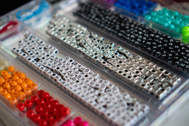 istock a set of beads with letters and multicoloured for create bracelets 1336654613