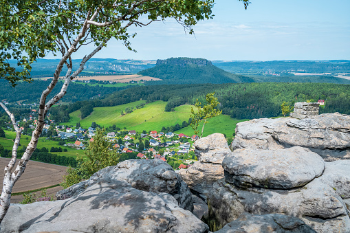 View from Pfaffenstein in Saxon Switzerland in summer. The Elbe Sandstone Mountains in the outward