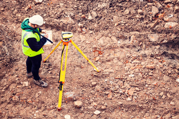 istock A surveyor on a construction site uses an optical level 1336656999