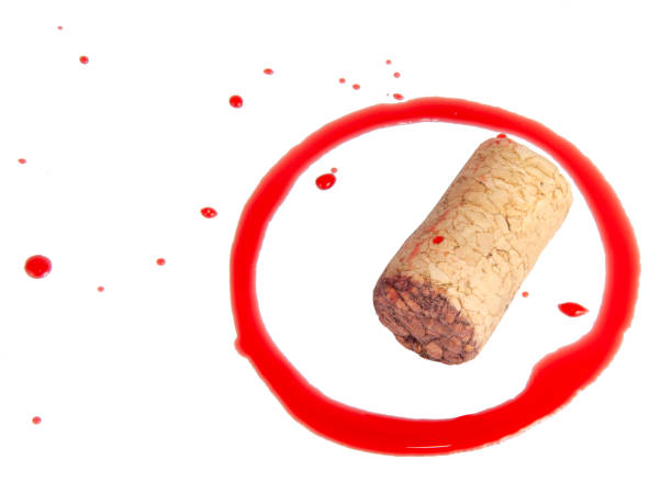 istock Wine cork and dirty red circle isolated on the white 1336657117