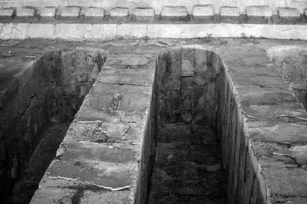 Photo of old stone structure, cistern and dungeon structure. Dara Ancient City, Mardin Province, Turkey. black and white photograph.