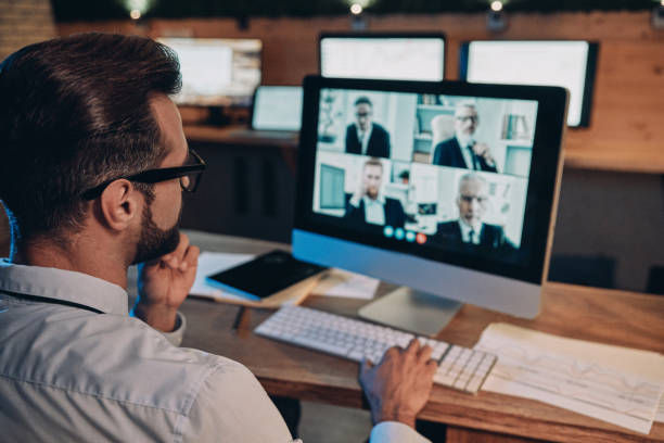 istock Confident young man having video conference with the colleagues 1336658218