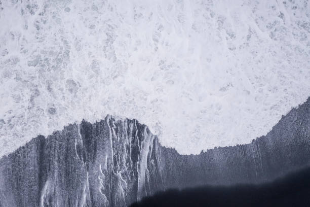istock Black sand beach with basalt columns from aerial view 1336659780