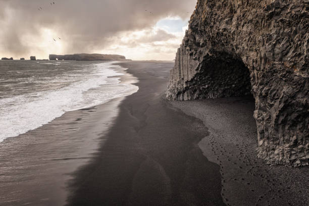 istock Black sand beach with basalt columns from aerial view 1336659781