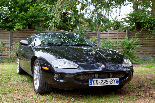 Lamorlaye, France - July 05 2020: The Jaguar XKR is a grand tourer manufactured and marketed by British automobile manufacturer Jaguar Cars.