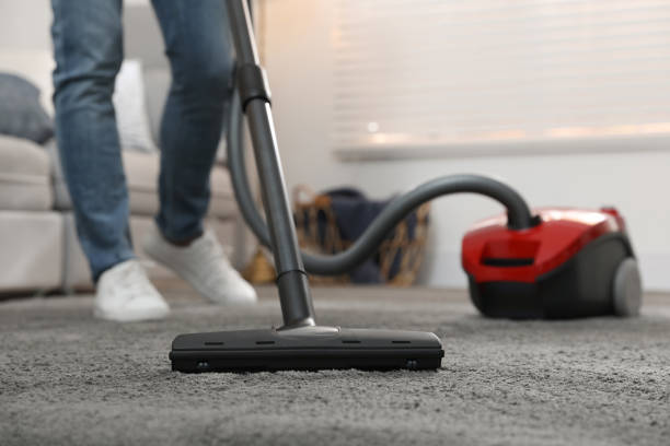 young man using vacuum cleaner at home, closeup - appliance living room domestic room lifestyles imagens e fotografias de stock