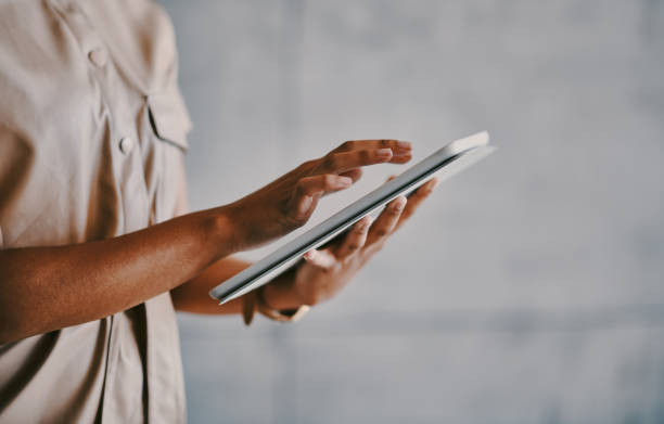 istock Shot of a businesswoman using her digital tablet at work 1336662594