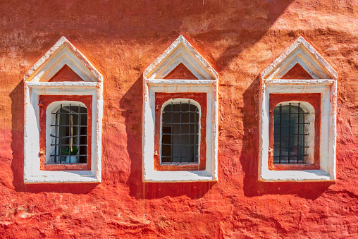 Three old vintage windows in ancient russian monastery
