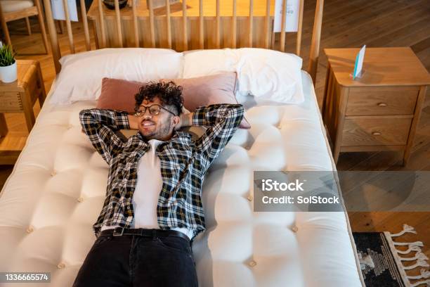 Testing Out Beds Stock Photo - Download Image Now - Mattress, Shopping, Retail