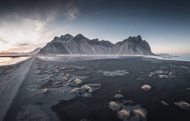 istock Big mountains and black sand at sunset 1336666055