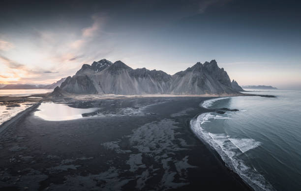 istock Big mountains and black sand at sunset 1336666075