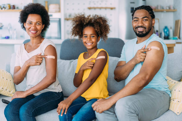 istock Family showing their arms after getting vaccinated. 1336668984