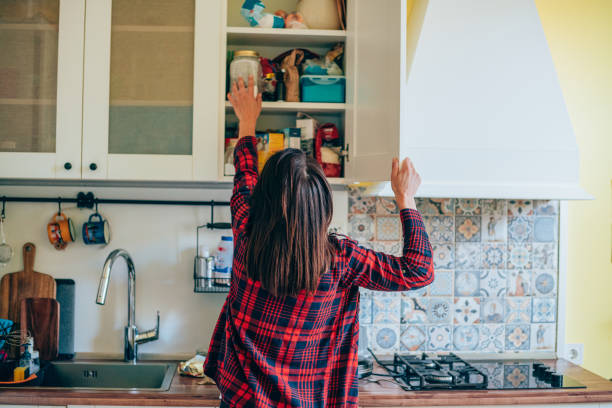 istock Housewife organizing the kitchen. 1336669463
