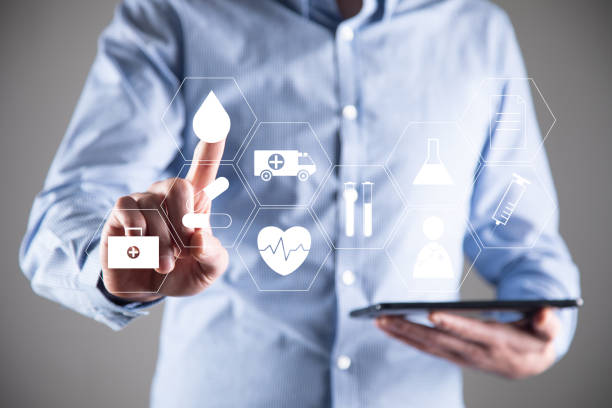 istock businessman holding digital tablet with Medical icon 1336672820