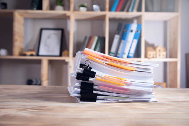 istock pile of document on desk 1336672866