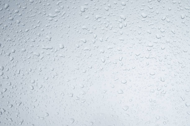 istock Rain drops and dew. water drops on a gray car roof after stopped raining , selective focus waterproof surface. soft focus. Leave space for writing text background. 1336676827