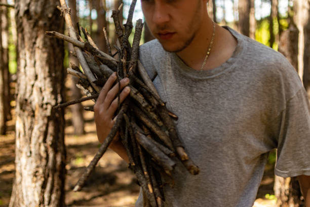 istock Young man with backpack on his back, walking through the pine wood forest, exploring, hiking and enjoying the nature and the view, relaxing. 1336679742