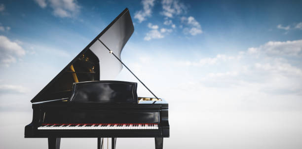 istock Grand piano on blue sky background 1336682794