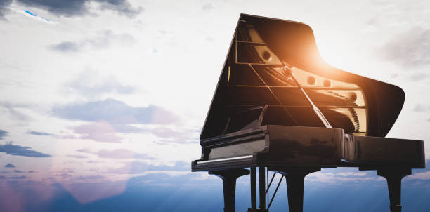 istock Grand piano on sunset sky background 1336682796