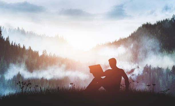 Man with laptop on the forest track at sunrise. Man with laptop on the forest track at sunrise. 5G internet, wireless concept. timberland arizona stock pictures, royalty-free photos & images
