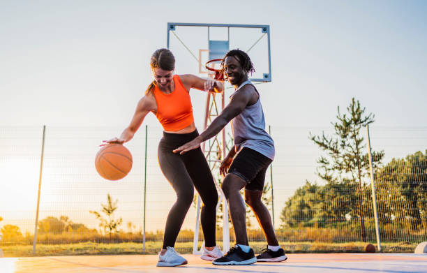 istock Couple enjoying basketball match 1336687970