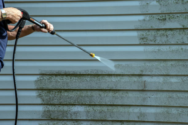 istock Power washing in progress on the north outer wall. 1336689133
