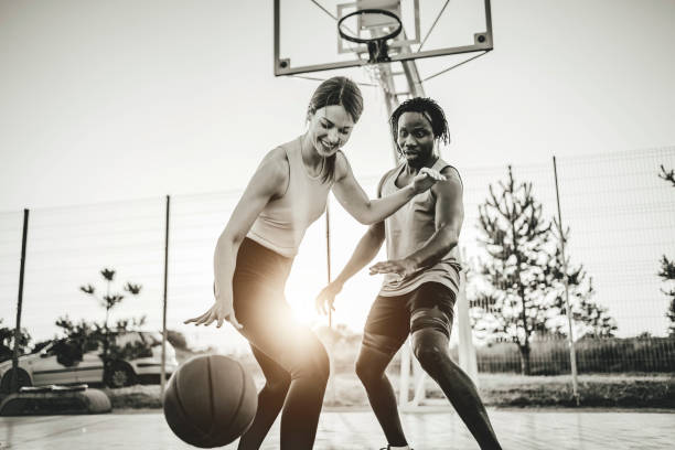 istock Couple enjoying basketball match 1336689137